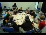 Attendees practicing their picking skills at the lockpicking village. Photo by visago.