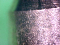 Scratches on the sides of pins are also common evidence of lockpicking.
